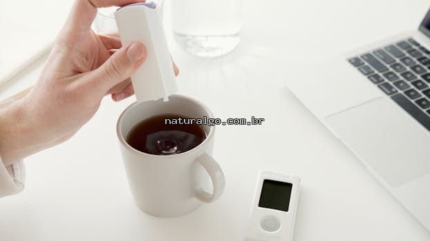 Close-up of a hand adding sweetener to coffee, ideal for diabetic care.